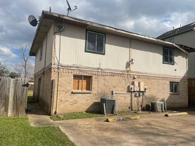 view of property exterior featuring central AC and a patio area