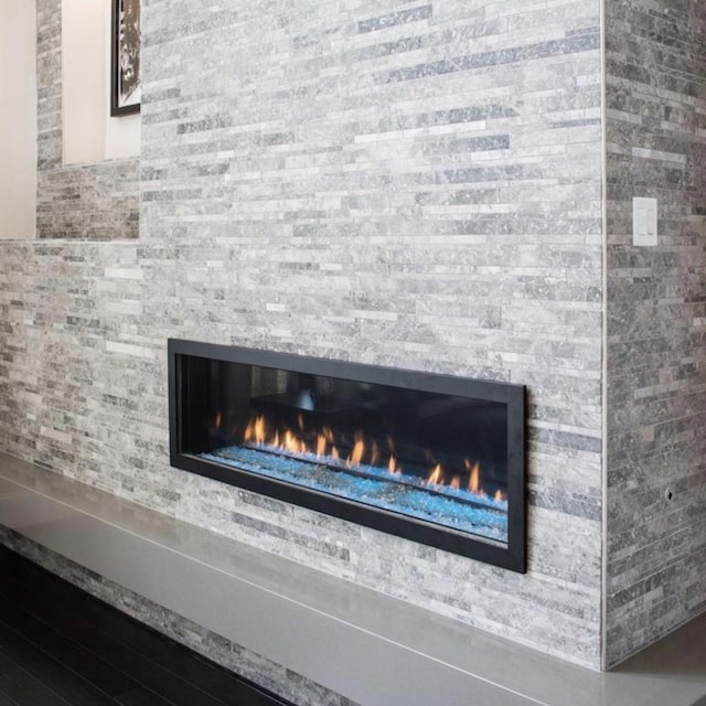 details with a stone fireplace