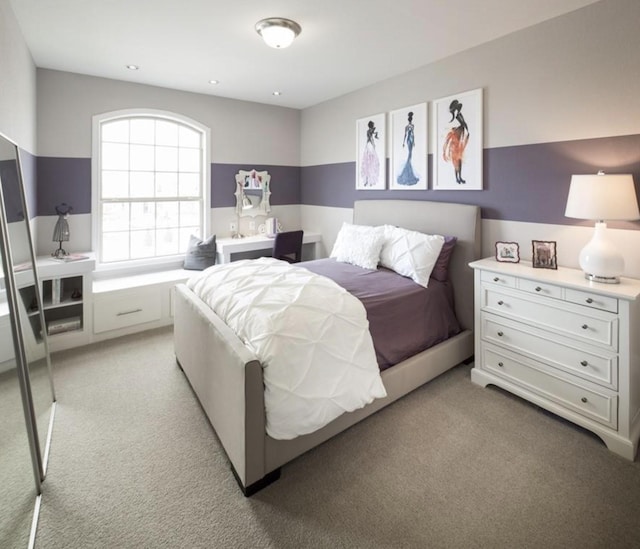 bedroom featuring light carpet