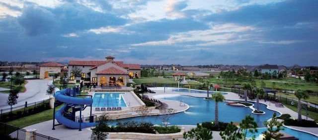 view of swimming pool featuring a water slide