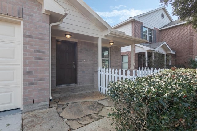 entrance to property featuring a garage