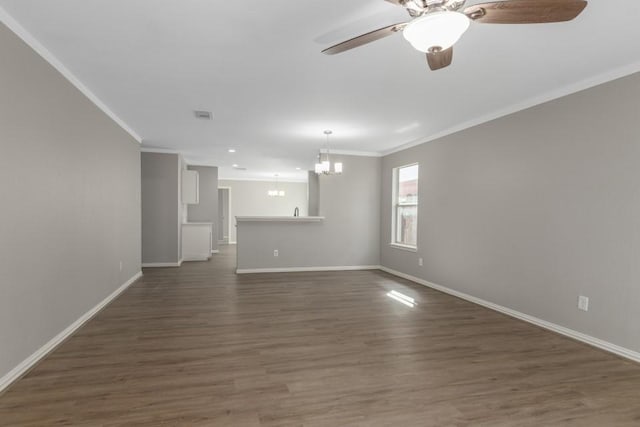 unfurnished living room featuring ornamental molding, dark wood-type flooring, and ceiling fan with notable chandelier