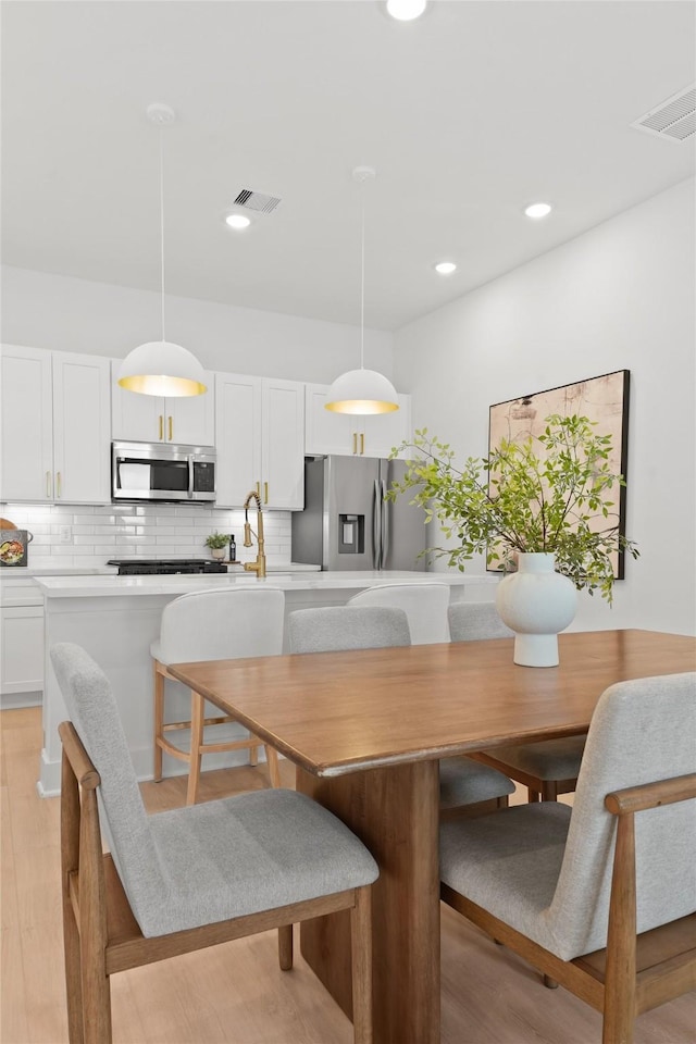 dining area featuring light hardwood / wood-style flooring