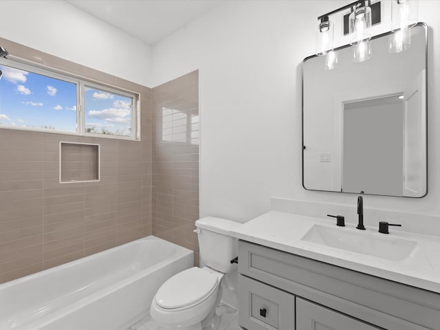 full bathroom with vanity, tiled shower / bath combo, and toilet