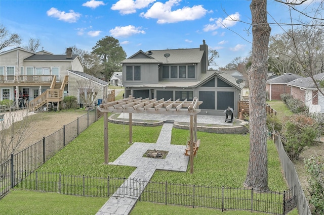 rear view of house featuring a patio, an outdoor fire pit, and a lawn