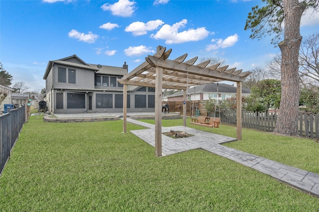 back of house with a lawn, a patio area, and a pergola