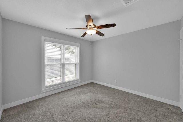 carpeted empty room featuring ceiling fan