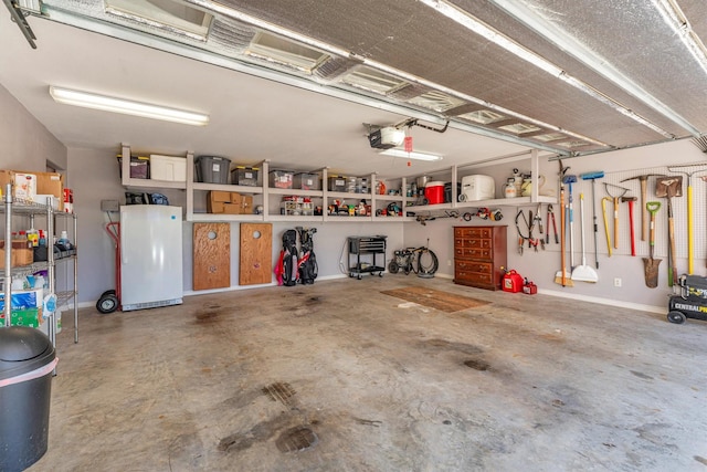 garage featuring a garage door opener and white refrigerator