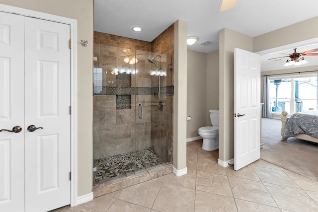 bathroom with tile patterned floors, an enclosed shower, ceiling fan, and toilet