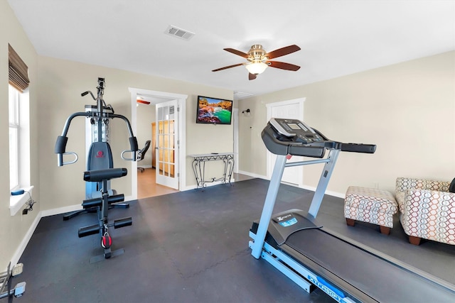 exercise area with french doors and ceiling fan