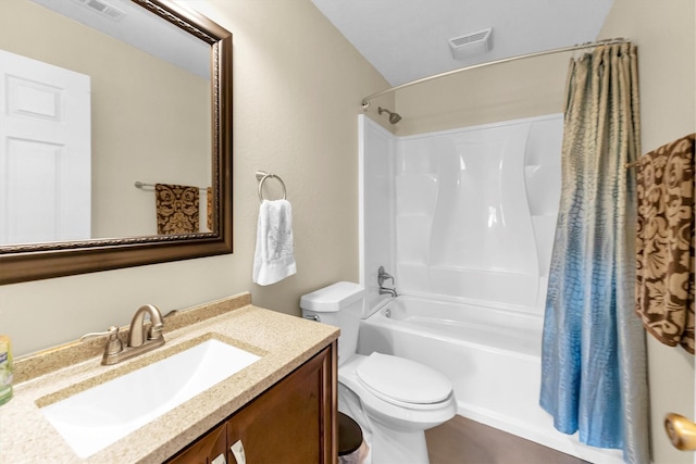 full bathroom featuring vanity, toilet, and shower / tub combo