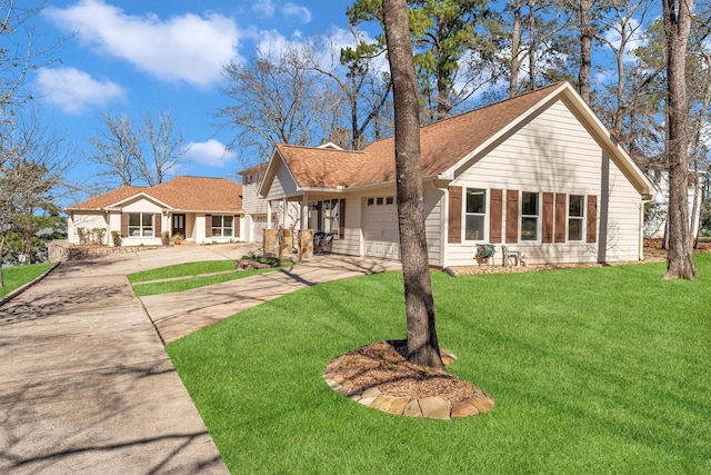 view of front facade featuring a garage and a front lawn