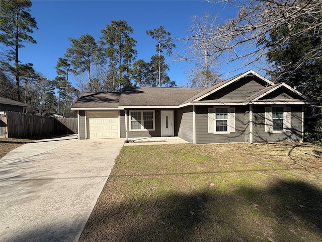 view of front of house featuring a garage and a front lawn