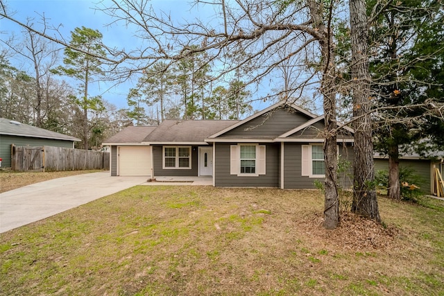 ranch-style home featuring a garage and a front lawn