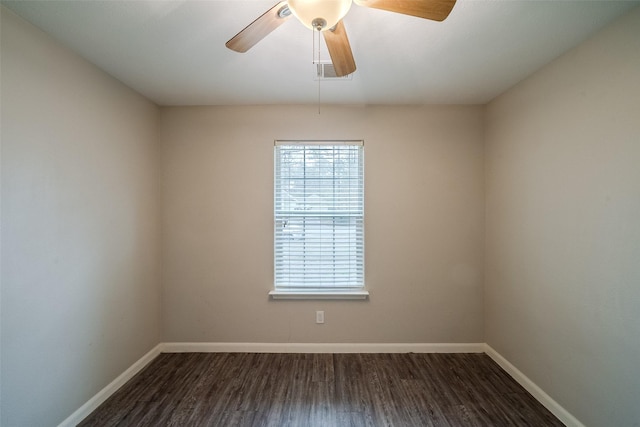 empty room featuring ceiling fan and dark hardwood / wood-style floors