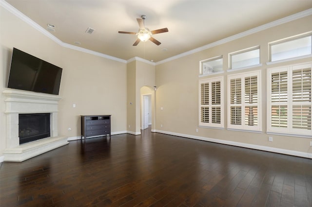 unfurnished living room with dark hardwood / wood-style flooring, crown molding, and ceiling fan