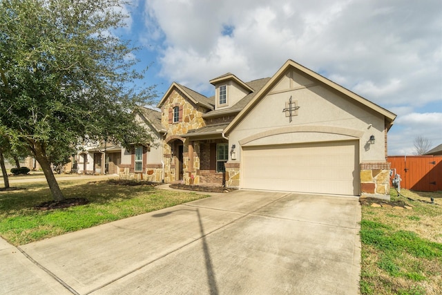 view of front facade featuring a garage and a front lawn