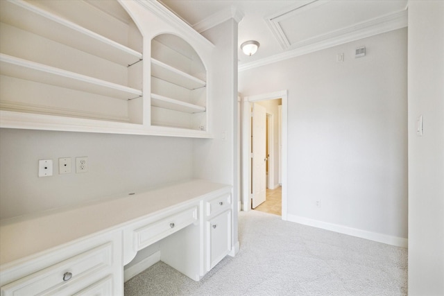 hallway featuring ornamental molding and light carpet