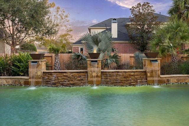 view of water feature featuring fence