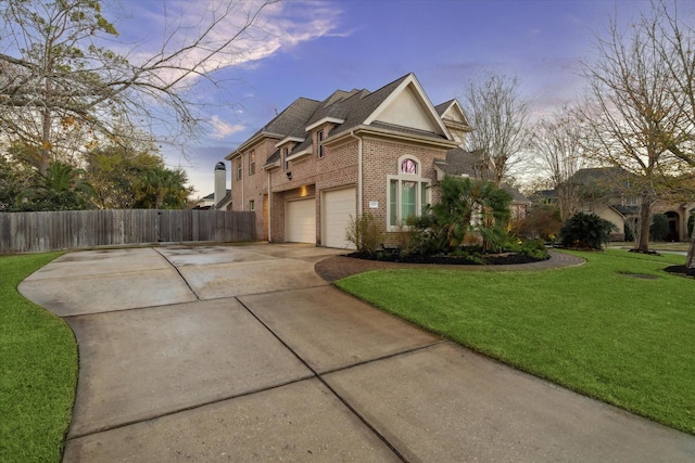 property exterior at dusk featuring a garage and a lawn