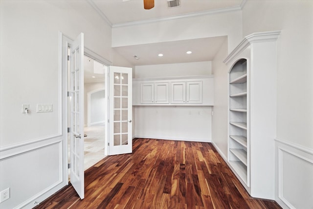 walk in closet with french doors, ceiling fan, and dark hardwood / wood-style flooring