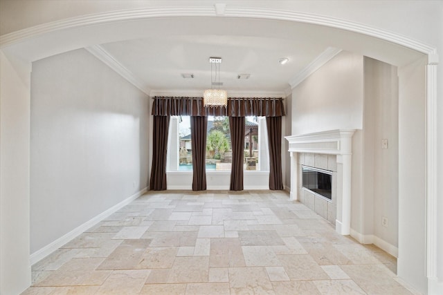 unfurnished living room with a tiled fireplace and ornamental molding