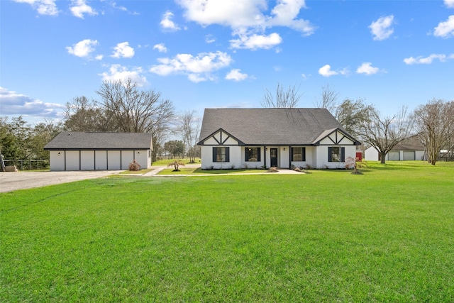 tudor-style house with a garage and a front lawn