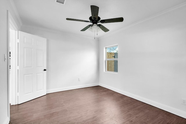 empty room with ceiling fan, ornamental molding, and dark hardwood / wood-style floors