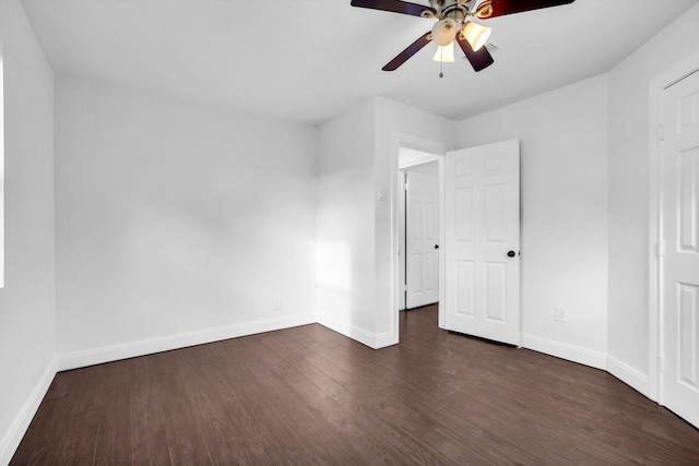 unfurnished bedroom featuring dark wood-type flooring and ceiling fan