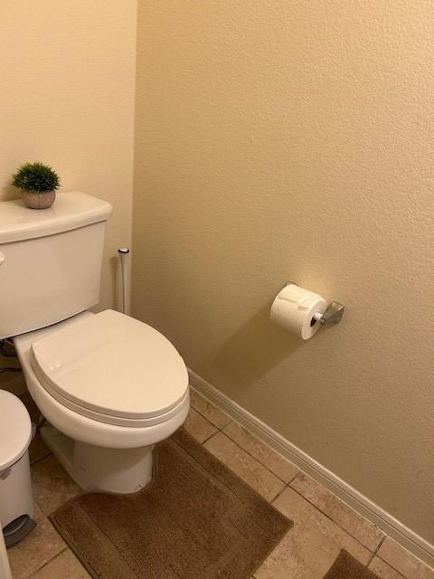 bathroom with tile patterned floors and toilet