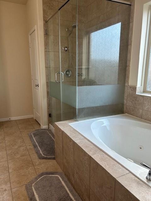 bathroom featuring independent shower and bath and tile patterned flooring