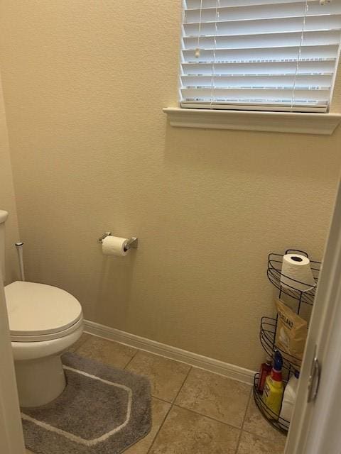 bathroom featuring tile patterned floors and toilet