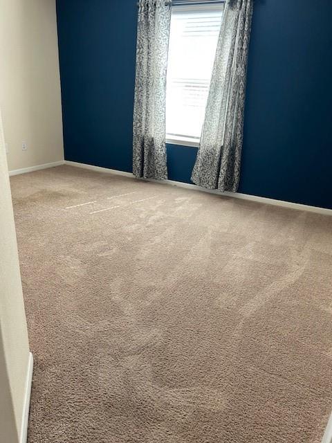 empty room featuring carpet floors