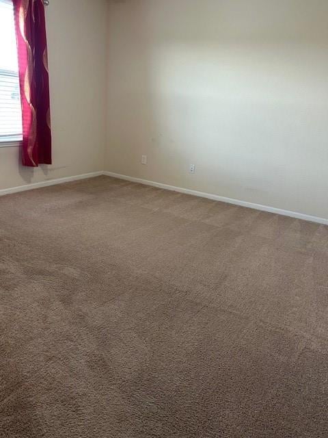 empty room with carpet flooring