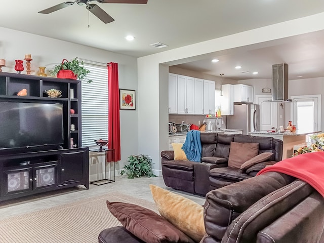 living room with ceiling fan