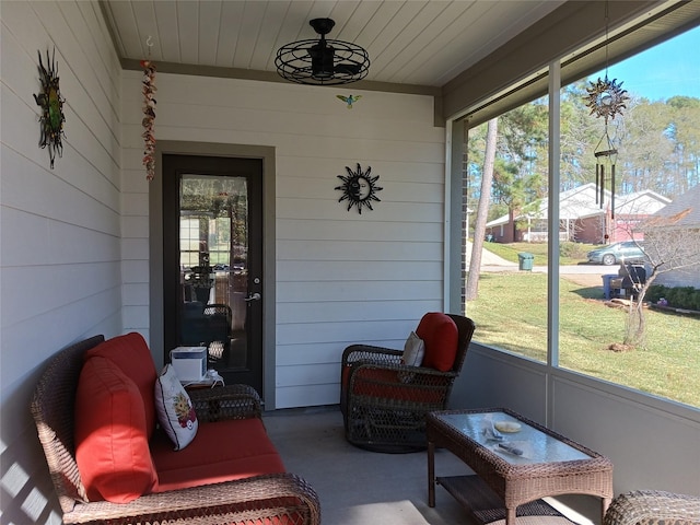 sunroom / solarium featuring wood ceiling