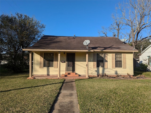 bungalow-style house featuring a front yard