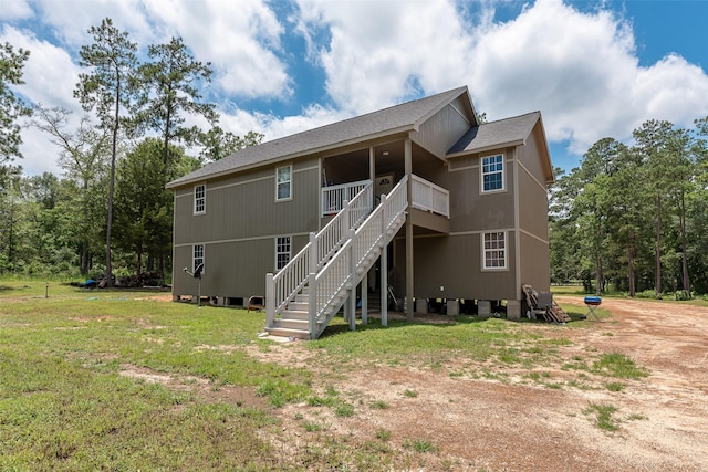 back of house featuring a yard