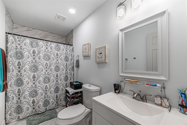 bathroom featuring vanity, toilet, and a shower with shower curtain