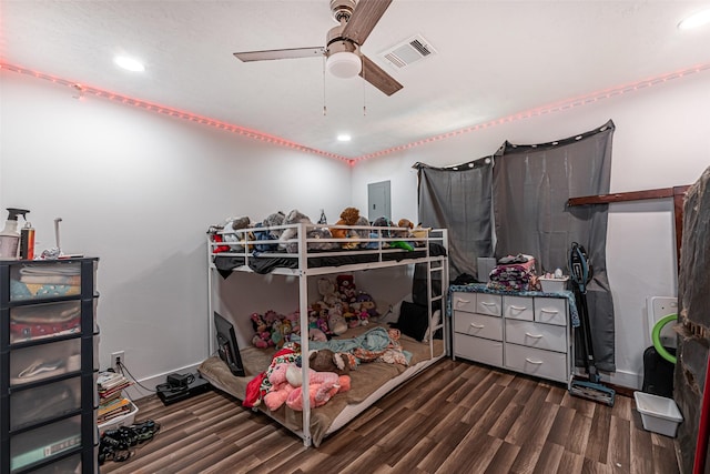 bedroom featuring dark hardwood / wood-style flooring, electric panel, and ceiling fan