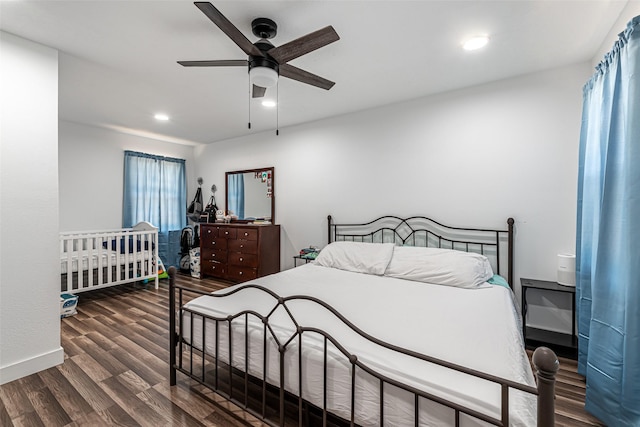 bedroom featuring dark wood-type flooring and ceiling fan