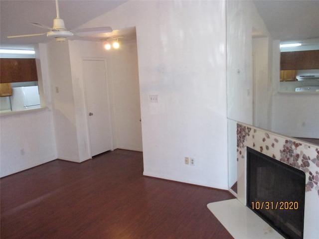 unfurnished living room featuring dark hardwood / wood-style flooring and ceiling fan