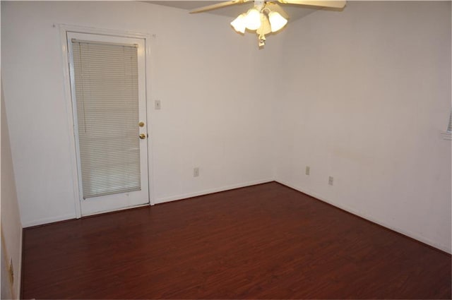 unfurnished room with ceiling fan and dark hardwood / wood-style flooring