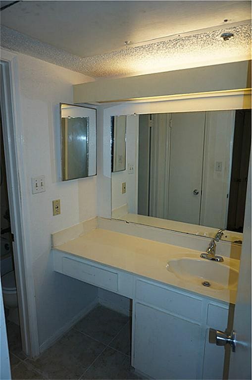 bathroom featuring vanity and tile patterned floors