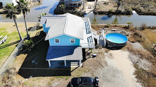 birds eye view of property featuring a water view