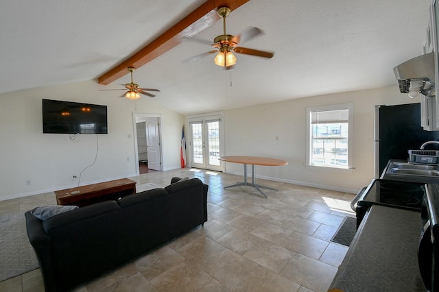 living room with lofted ceiling with beams, sink, and french doors