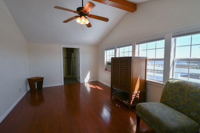 living area with dark wood-type flooring, lofted ceiling with beams, and ceiling fan