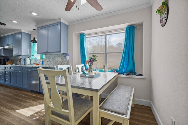 dining room with crown molding, plenty of natural light, and dark hardwood / wood-style floors