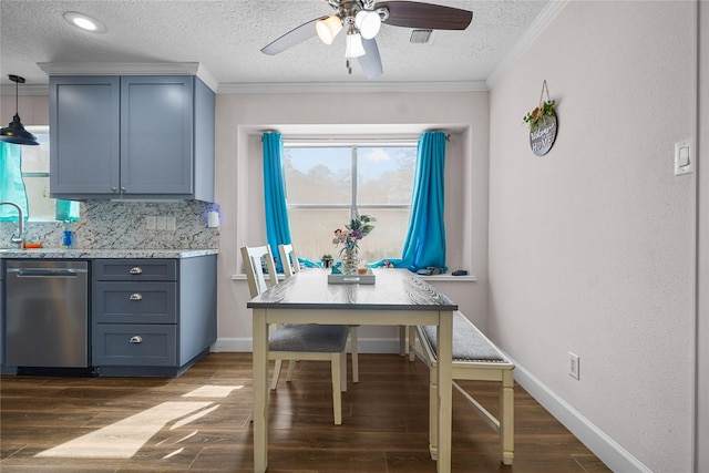 dining space featuring crown molding, ceiling fan, dark hardwood / wood-style flooring, and a textured ceiling