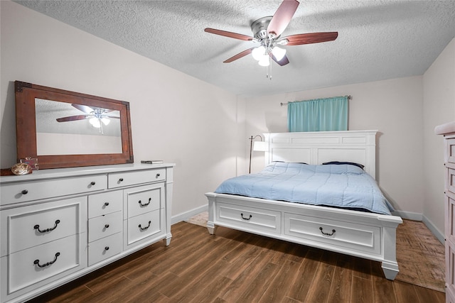 bedroom featuring ceiling fan, a textured ceiling, and dark hardwood / wood-style flooring